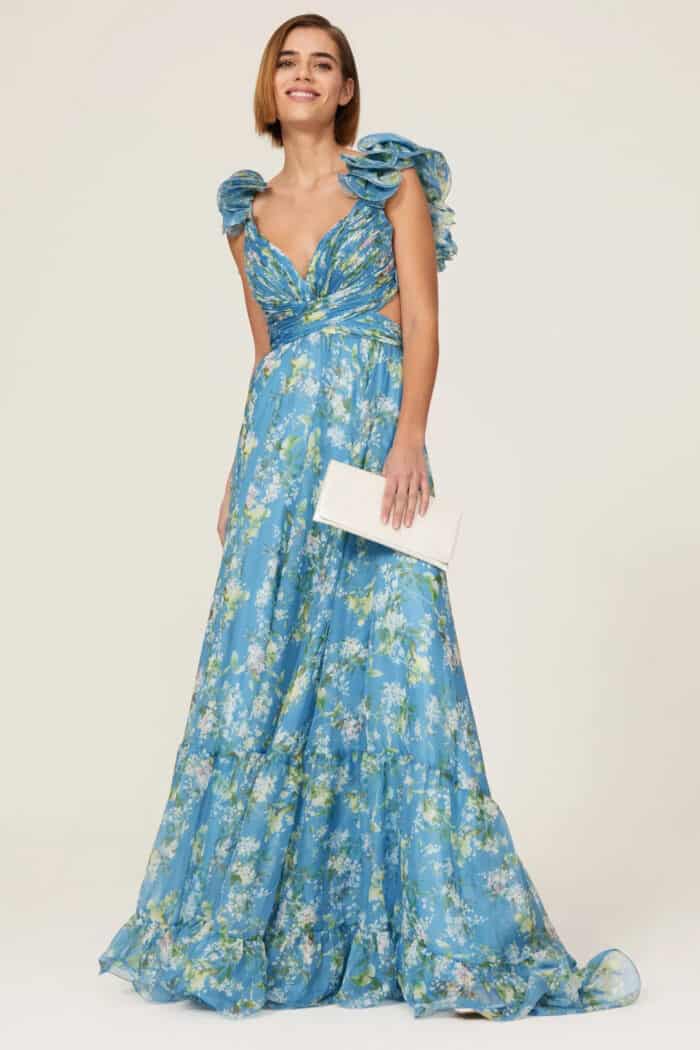 Model wearing blue floral ball gown